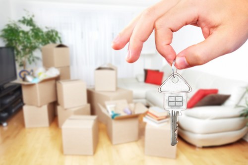 Professional movers transporting belongings from an Enfield home