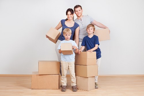 Packed student boxes and furniture ready for collection in Enfield