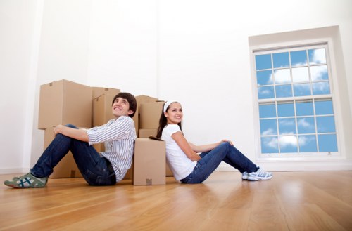 Careful loading of boxed household items and furniture for a local move