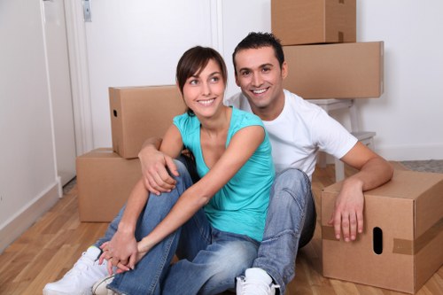 Moving staff handling items carefully during a relocation in Enfield