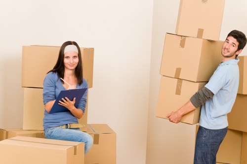 Local moving team handling boxes and household items in Enfield