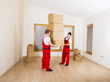 Commercial office relocation team handling desks and equipment in Enfield